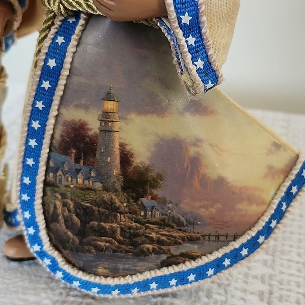 Thomas Kinkade 2004 lighthouse painting with anchor tabletop decor